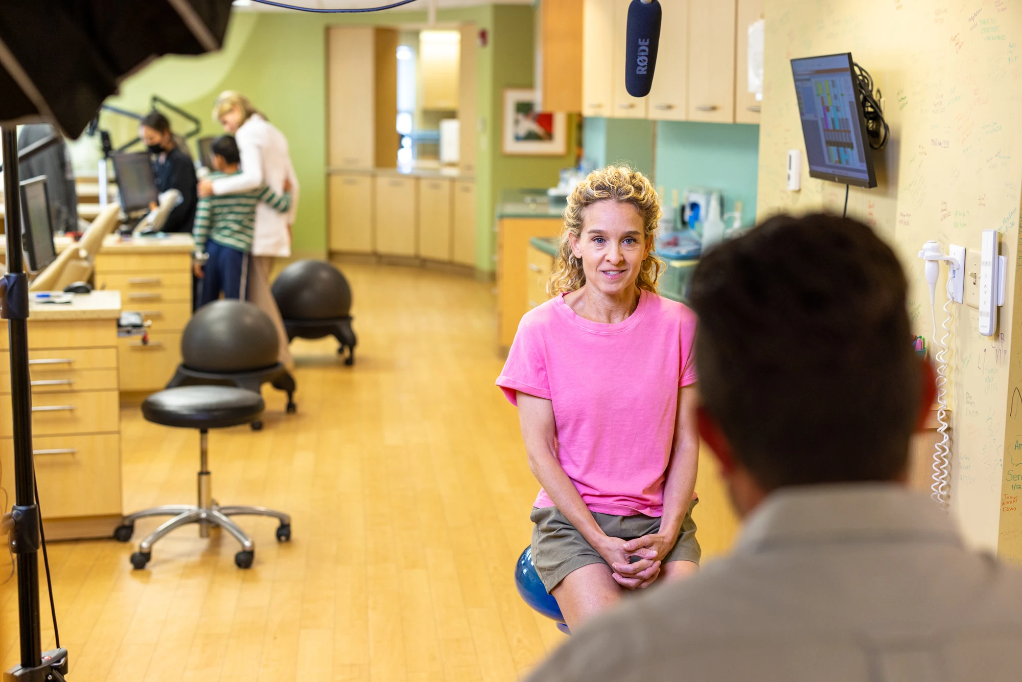 A smiling patient in the Cheron Orthodontics consultation room